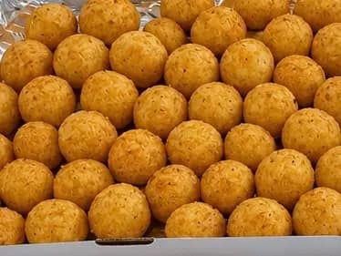 Round crumbed cheese balls, fried golden
