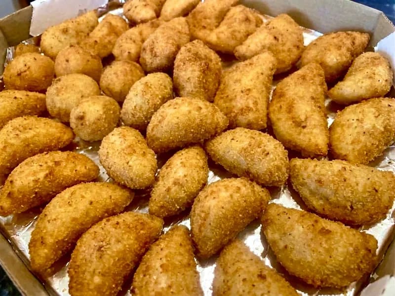 Half-moon beef rissoles, crumbed and fried golden